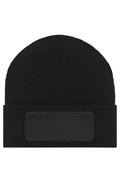 MB7403 - Knitted Beanie with Patch (10cm x 5cm) in black Größe one size von Daiber